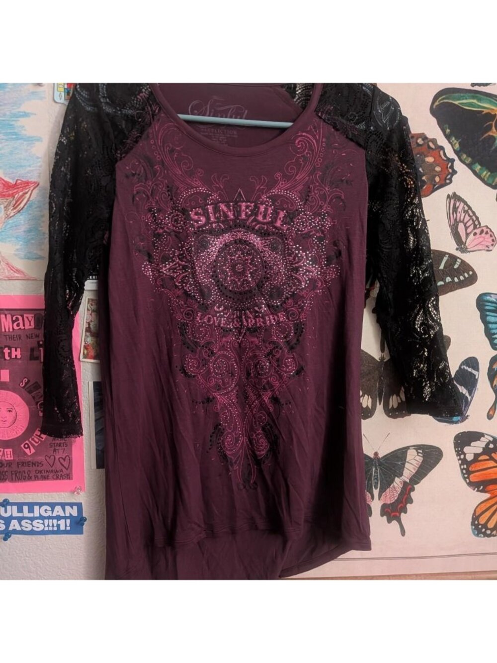 Burgundy long sleeve top with black lace sleeves and rhinestone details